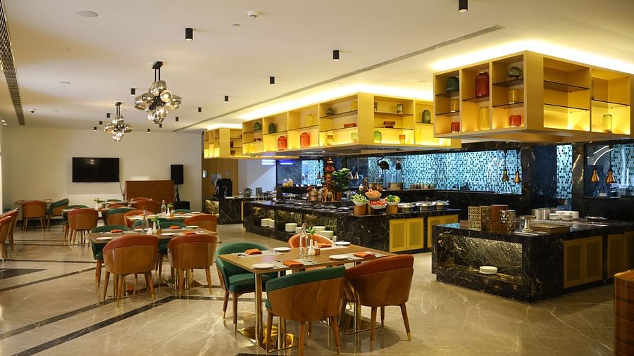 Relax in comfort at The bar, where plush interiors enhance your dining experience.
