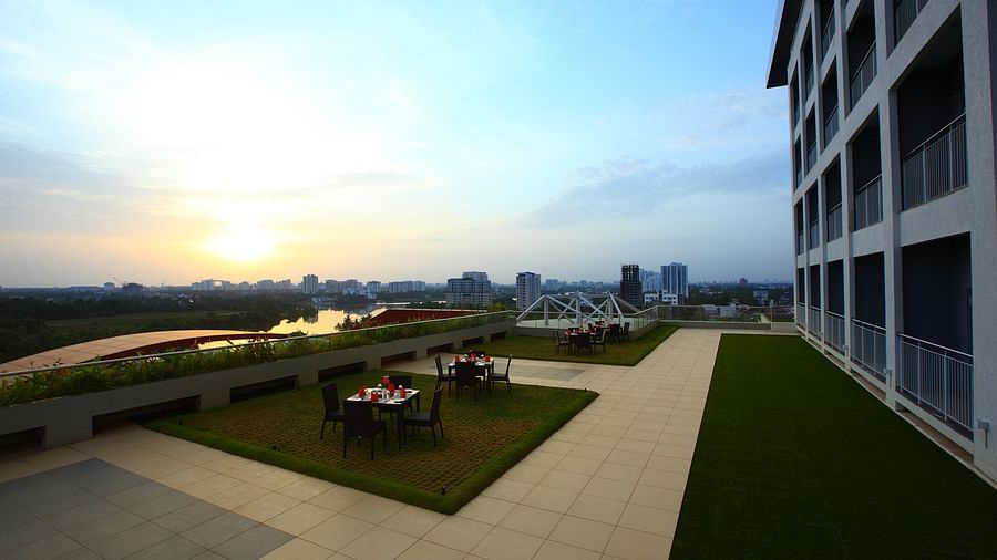 Far out view of the seating arrangement inside Terrace Garden - Starlit Suites, Kochi