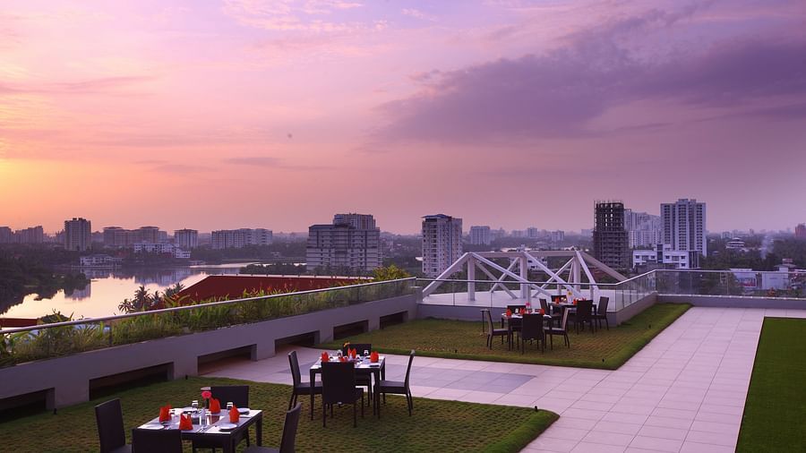 Seating arrangement inside the Terrace Garden in the evening - Starlit Suites, Kochi