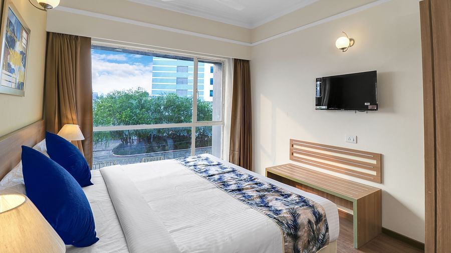 a double bed inside Deluxe One Bedroom Suite 3 - Starlit Suites Newtown, Kolkata