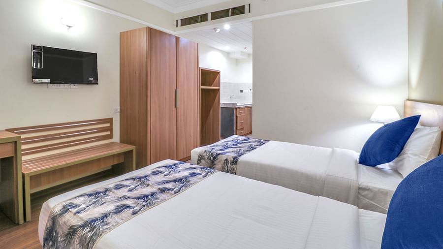 twin beds inside Deluxe One Bedroom Suite 3 - Starlit Suites Newtown, Kolkata