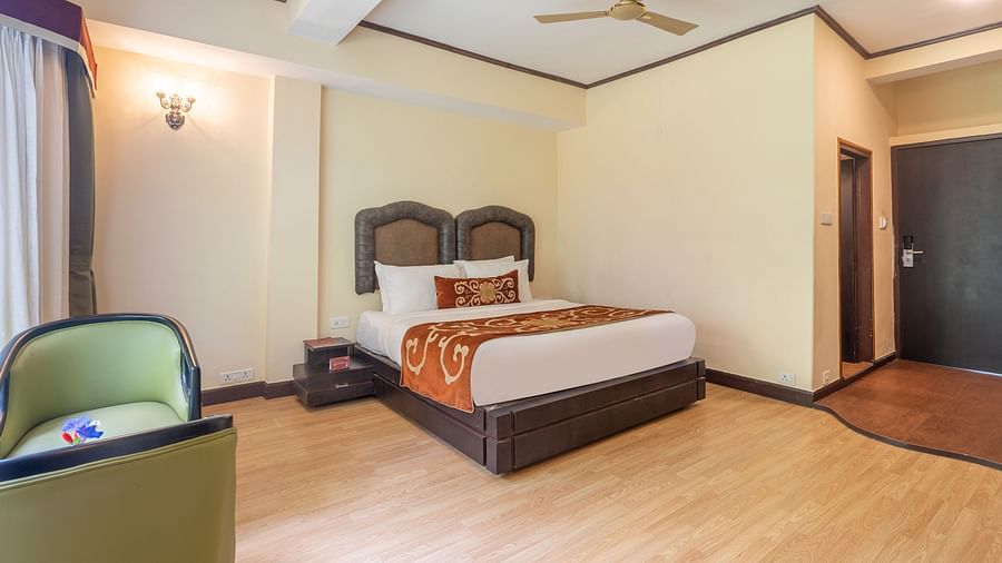 king size bed  of deluxe bed at Summit Lillium Hotel & Spa, Kalimpong
