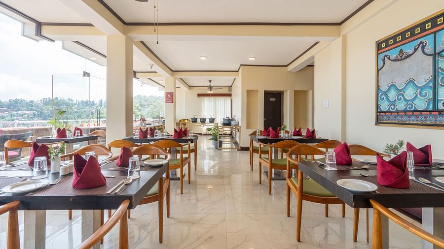 dining setting in a restaurant at Summit Lillium Hotel & Spa, Kalimpong