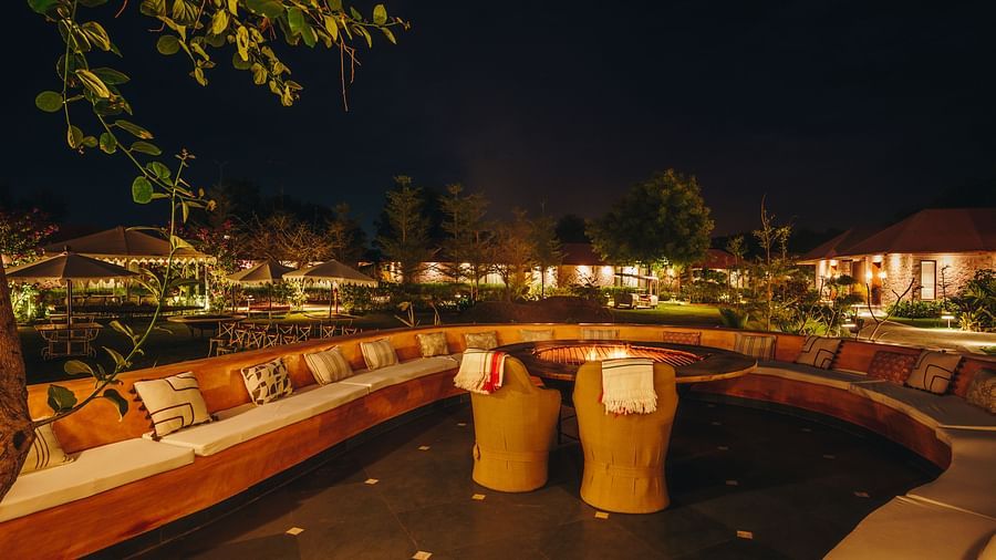 Village Lounge dining area with two seats in the middle at Surpura Bagh.