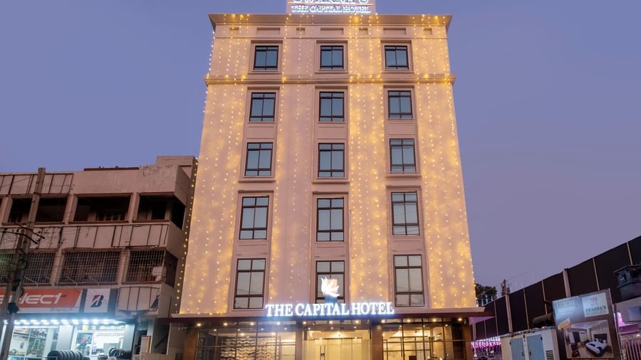 Night view of Swarna's The Capital with its illuminated facade standing tall in the city centre.