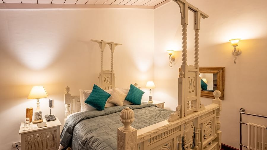 A room with a bed and lamps on both sides at Te Aroha By Shervani, Mukteshwar