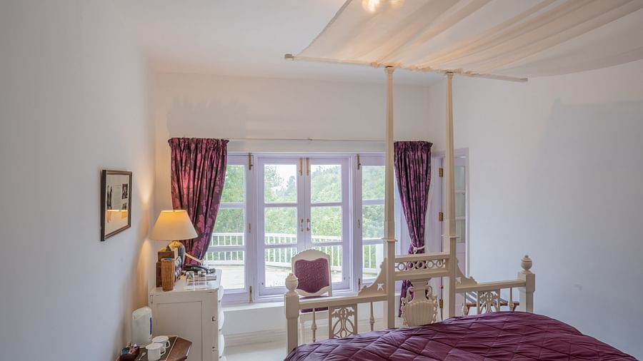 A room with a bed and a lamp on the side at Te Aroha By Shervani, Mukteshwar
