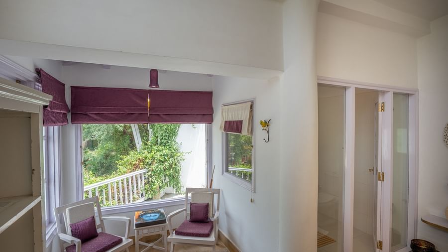 A bedroom with a large open window at Te Aroha By Shervani, Mukteshwar