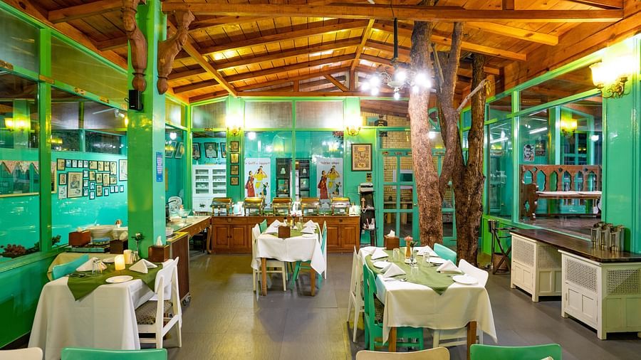 Restaturant area with tables and chairs at Te Aroha By Shervani, Mukteshwar
