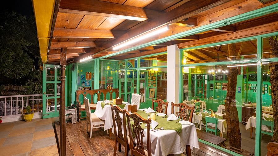 Dinning space with tables, chairs and wooden ceiling at Te Aroha By Shervani, Mukteshwar