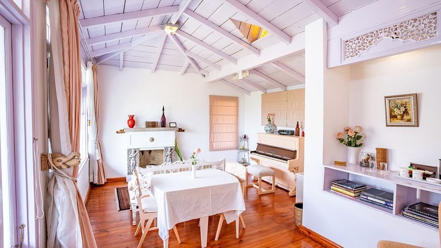 A living room with lamps and a sofa at Te Aroha By Shervani, Mukteshwar
