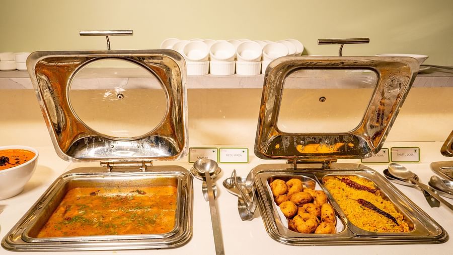 Chafing dishes with Indian cuisine on a buffet table - TGI Ameya Grand, Goa
