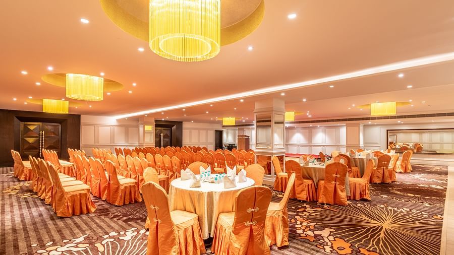 Banquet hall with round tables dressed in satin covers, perfect for a celebratory gathering