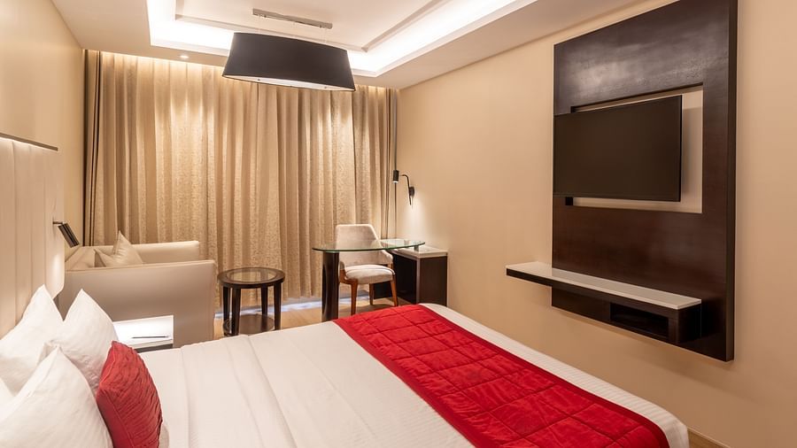 Grand Suite with elegant curtains and minimalist furniture- TGI Grand Fortuna, Krishnagiri Main Road, Hosur