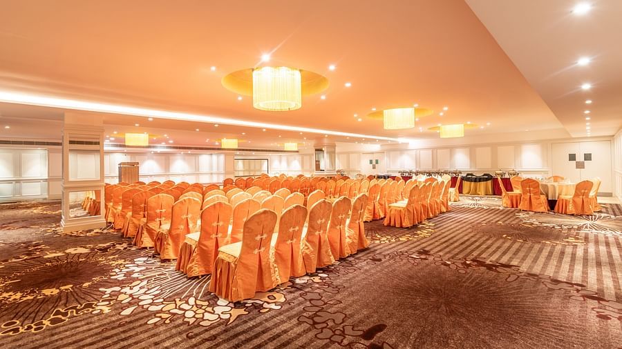 Brightly lit banquet hall with chairs arranged in rows for a formal seminar or presentation- TGI Grand Fortuna, Krishnagiri Main Road, Hosur