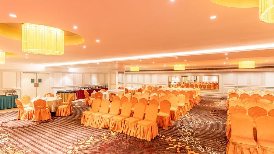 Spacious hall set up in classroom-style seating, ideal for training sessions or workshops