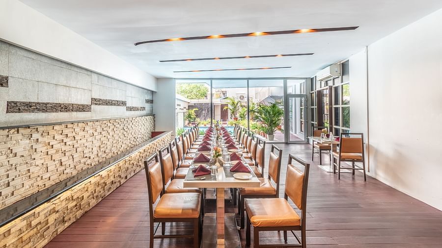 Spacious restaurant with stone walls and ample natural light