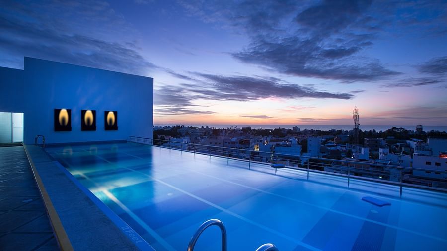Atithi rooftop pool at sunset