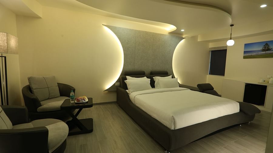 A view of Club Suite with a focus on the king size bed taken from near the entrance - TGI SPS Grand, Coimbatore