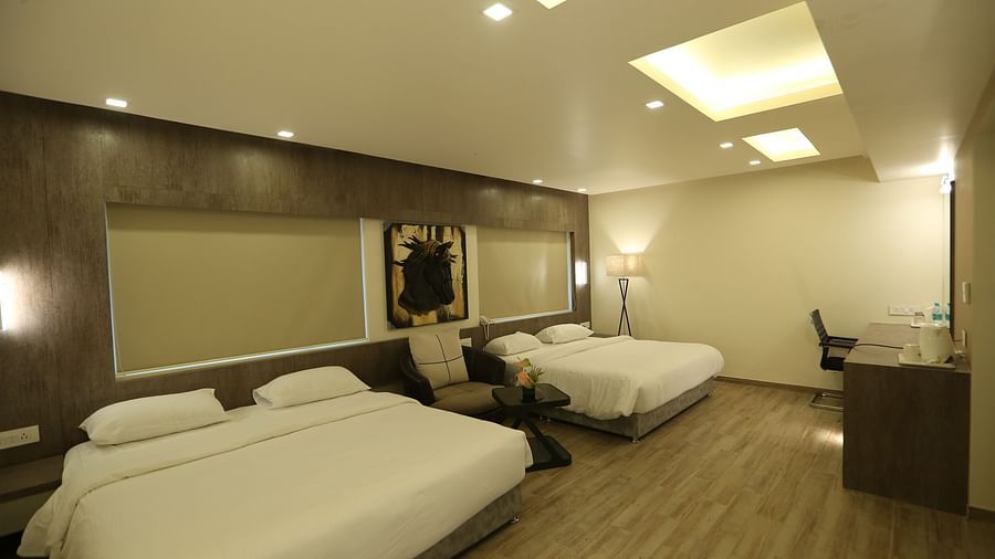 Club Suite featuring multiple beds and a desk area.