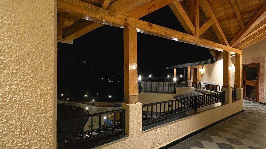 Outdoor balcony area with wooden beams at The Chamomile Estate.