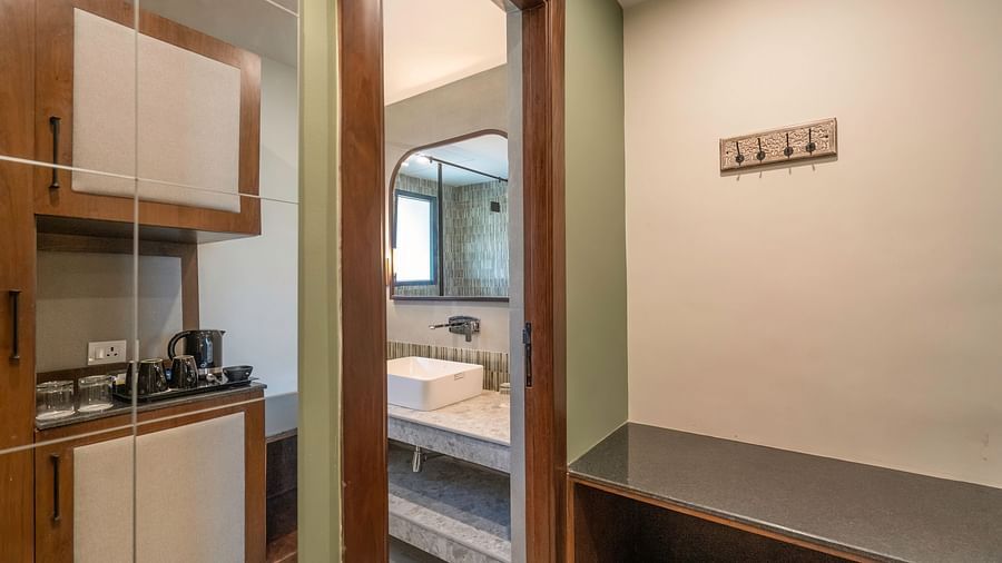 Room entrance with a view into the bathroom area, with a cupboard to the side at The Chamomile Estate.