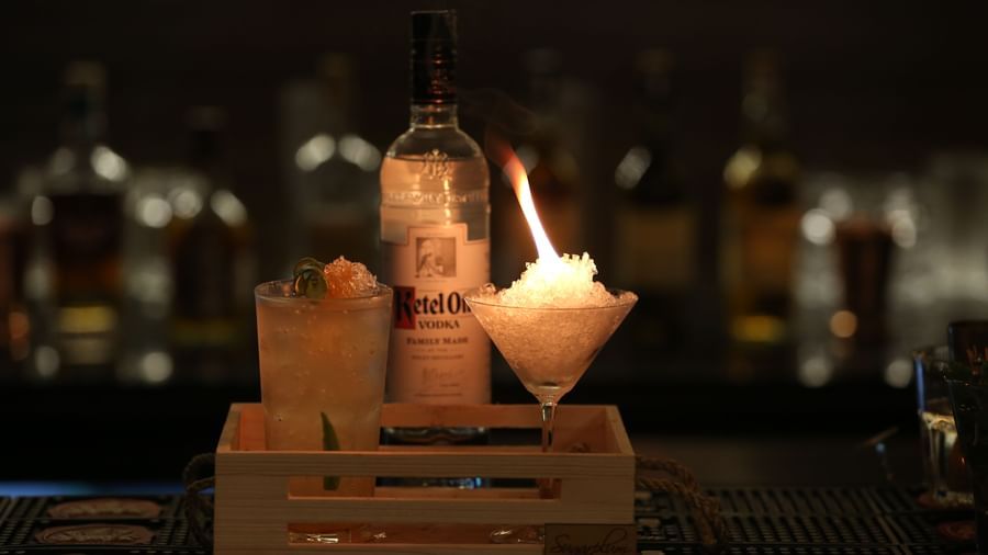 A creatively presented cocktail with a flaming garnish at The Citi Residenci Hotel, Durgapur.
