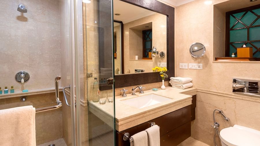 image of a bathroom with a cubical shower at The Claridges Nabha Residence