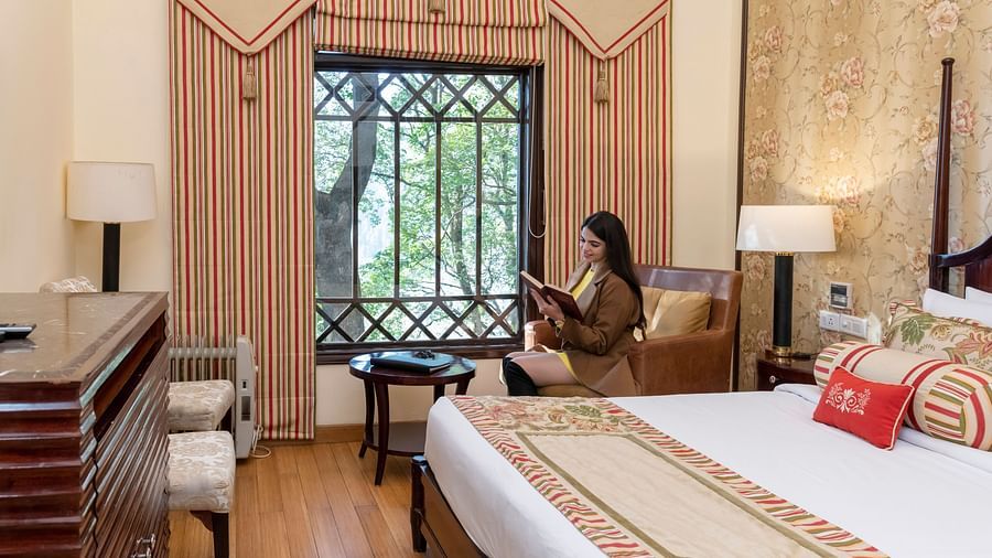 image of our duplex family suite with a big window with ample natural light falling into the room - The Claridges Nabha Residence