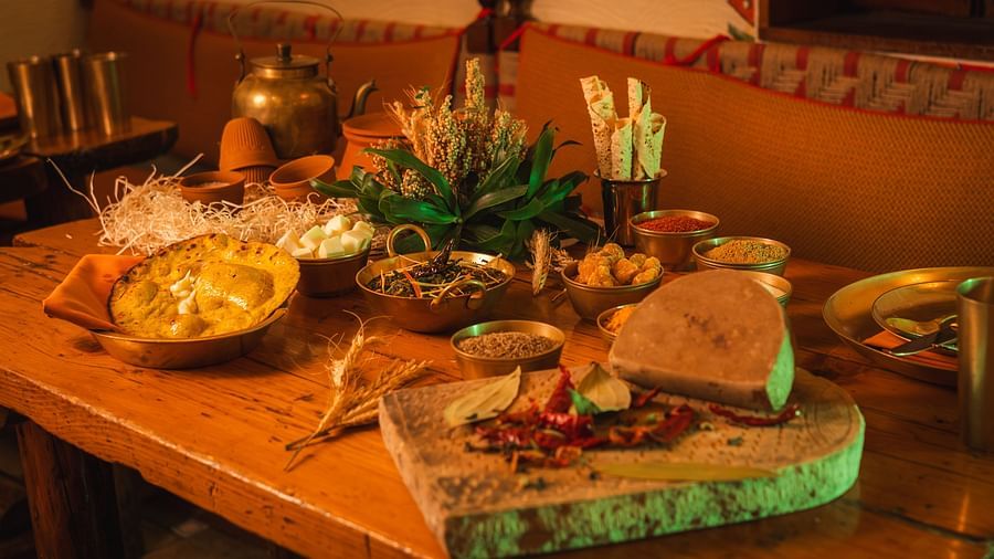 Image featuring an authentic Indian thali with a variety of delicacies served on a rustic table