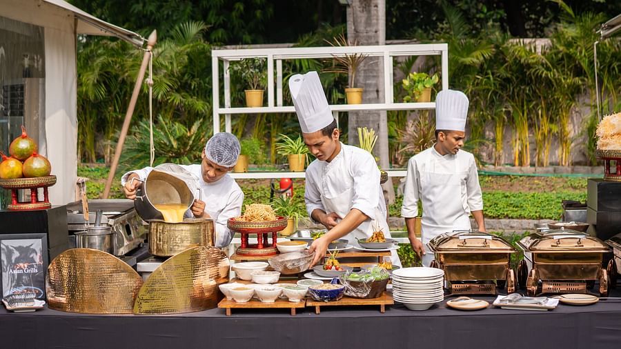 image of three chefs working at the buffet corner for an event hosted at the claridges garden - The Claridges New Delhi