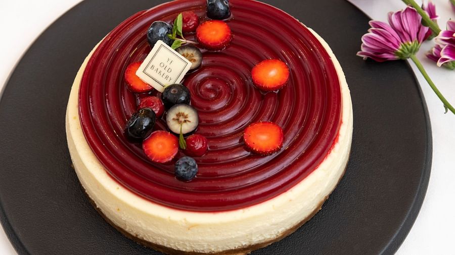 image of the new york baked cheesecake with seasonal exotic berries as toppings served by the ye old bakery - The Claridges New Delhi