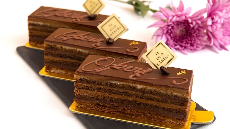 image of the opera pastry lined up with a pop up of the ye old bakery by The Claridges New Delhi