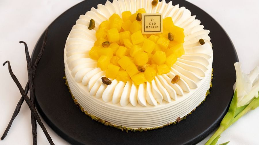 image of the pineapple cake with a layer of pineapple in the middle of the cake by the ye old bakery - The Claridges New Delhi