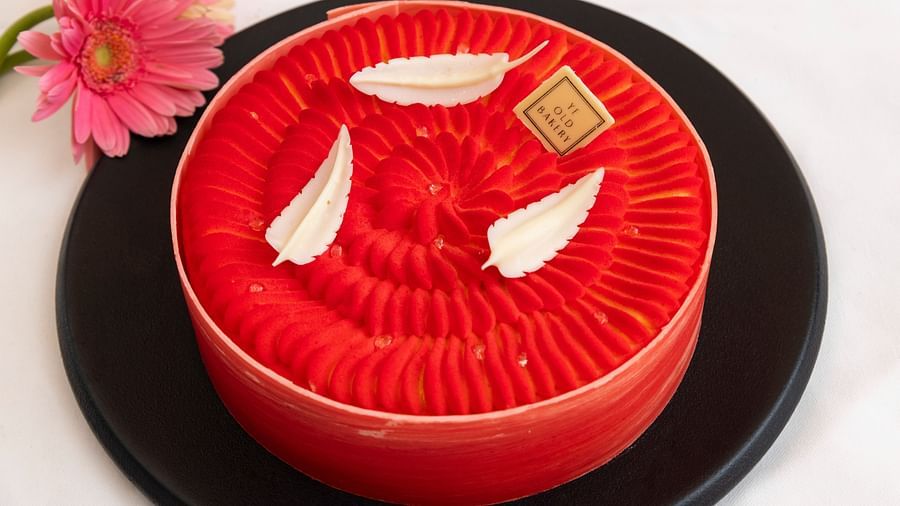 a round red velvet cake served by the ye old bakery - The Claridges New Delhi