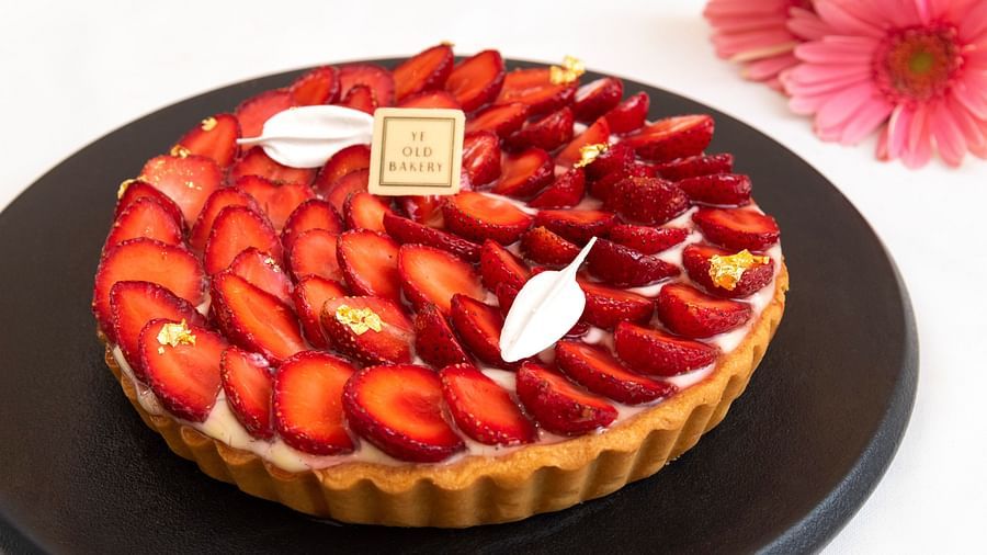 image of a strawberry tart with slices of strawberries layered over it served exclusively by the ye old bakery - The Claridges New Delhi