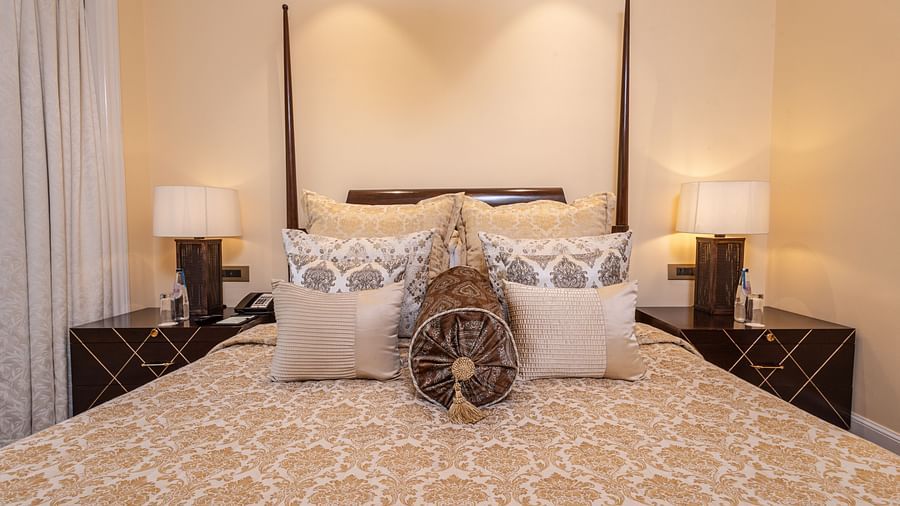 image of the bed at our lutyens luxury suite with well kept pillows and cushions - The Claridges New Delhi