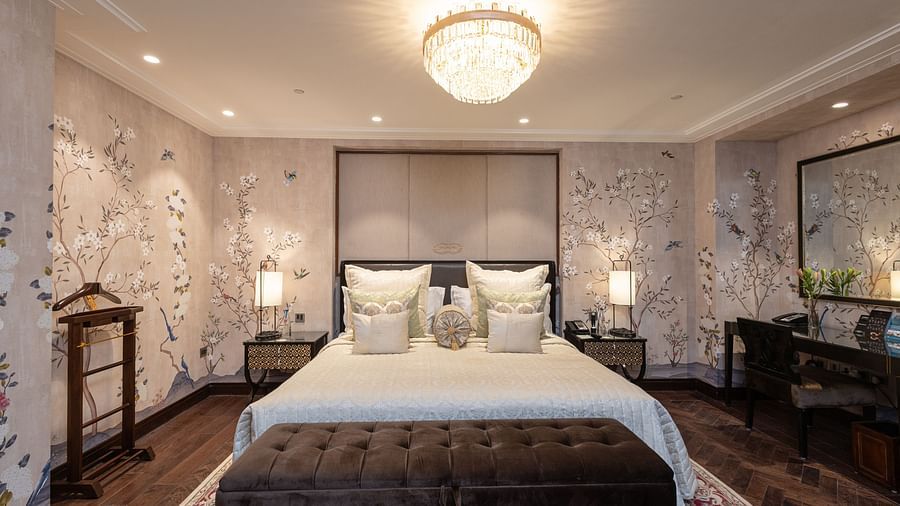 image of a bedroom with classy and elegant interiors featuring a king size bed at the cabana room - The Claridges New Delhi