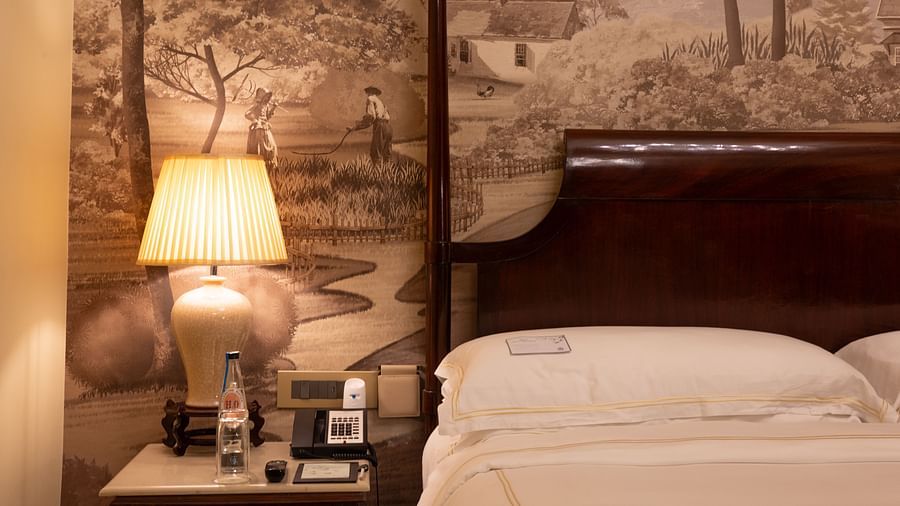 closeup image of the side table of our heritage room with a table lamp - The Claridges New Delhi