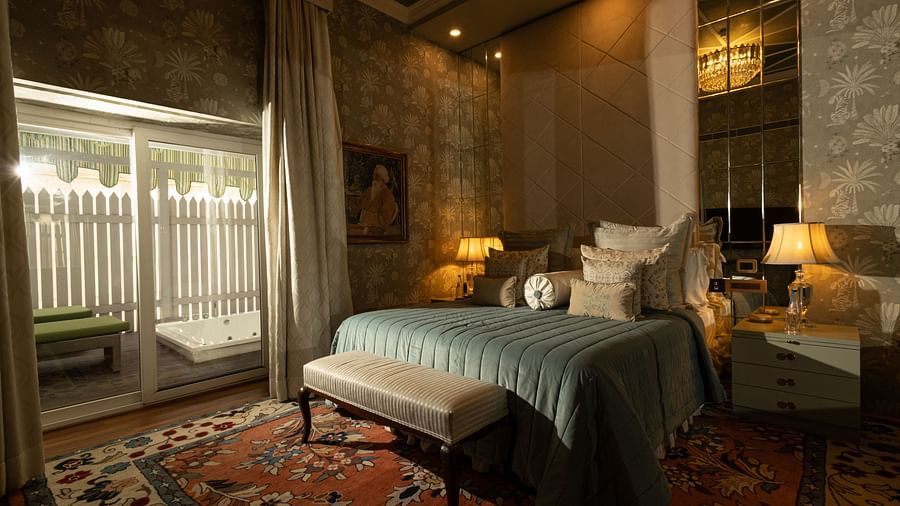 image of the bedroom of our heritage luxury suite with ample natural light coming from the windows - The Claridges New Delhi
