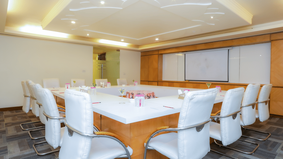 A well-arranged conference room with a large table and ergonomic chairs, ideal for business at The Conway, Meerut.