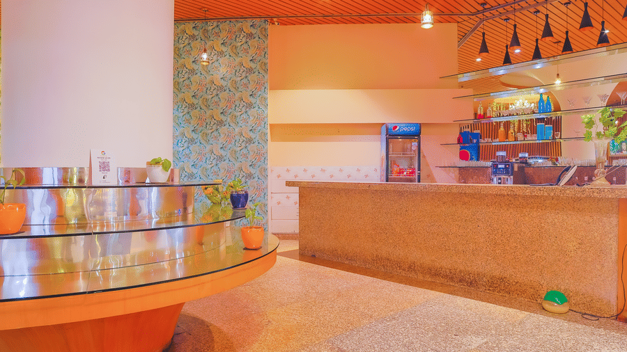 A modern cafe counter area with displays and a clean, inviting design at The Conway, Meerut.