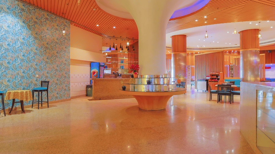 The welcoming entrance area of the hotel restaurant with a central decorative element at The Conway, Meerut.