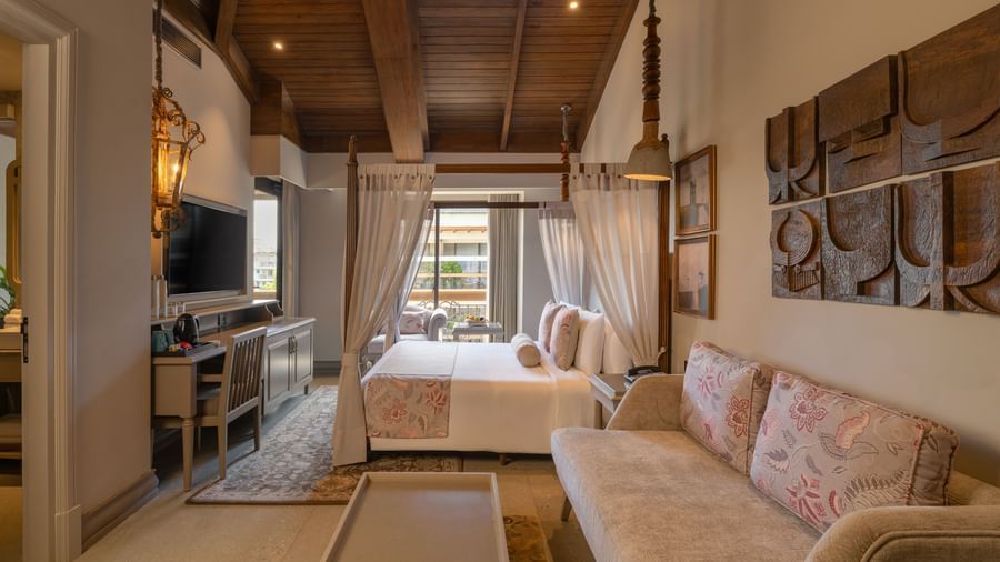 Side view of the Executive Room featuring a wooden ceiling and elegant furnishings at The Evren, Vagator.