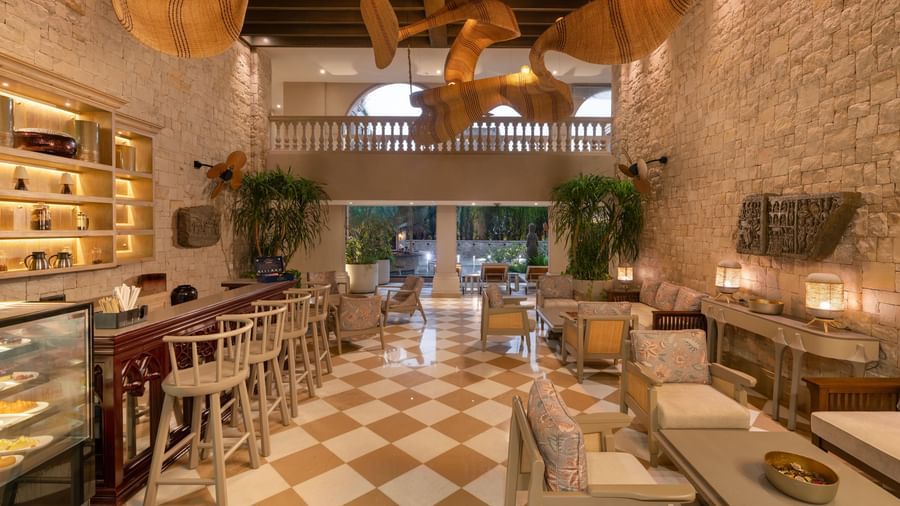 Full view of the Suenos de Cafe featuring a beautiful chandelier hanging from the ceiling.