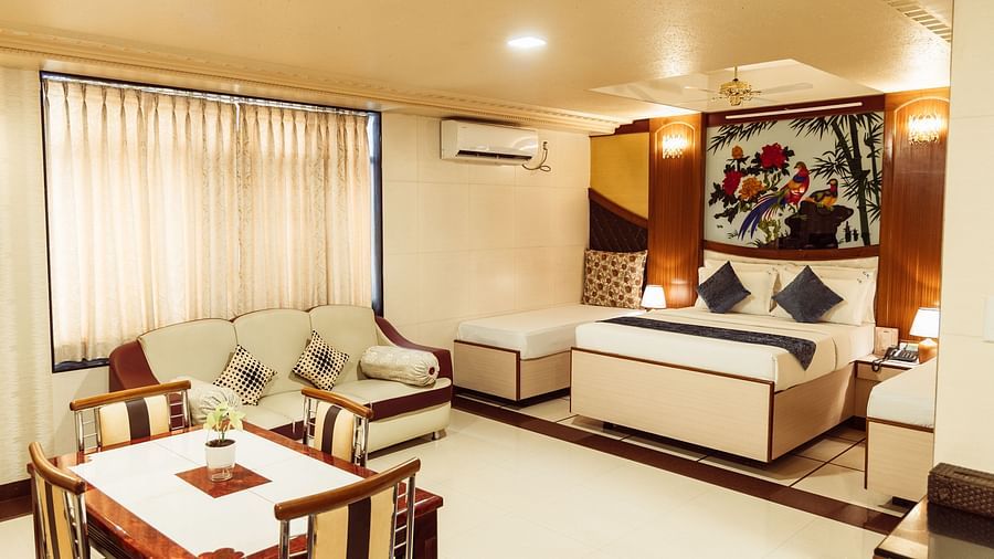 image of the grand suite featuring a luxurious bedroom with modern interiors and plenty of space at The Grand Krishna Rooms, Bengaluru