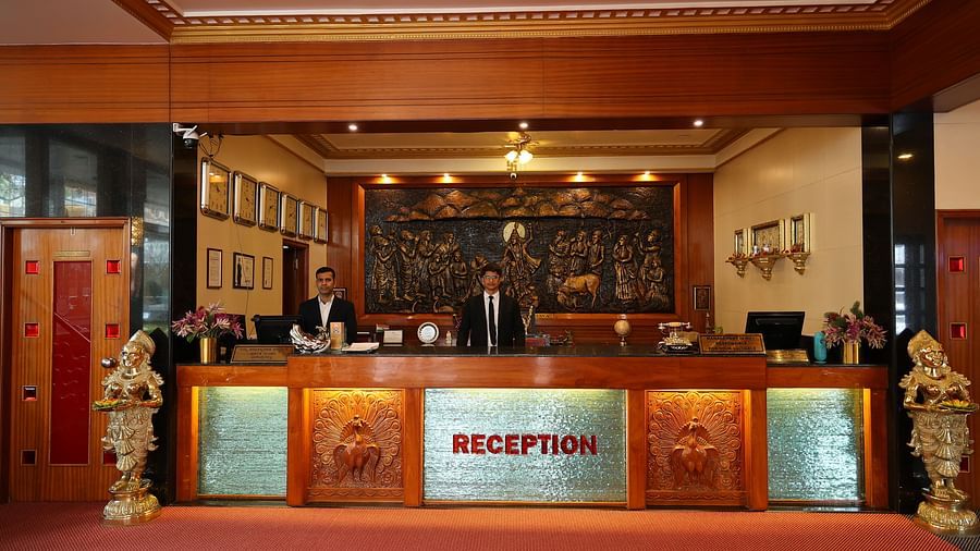 image of the reception at The Grand Krishna Rooms with a person standing dressed in business formals to attend to the guests