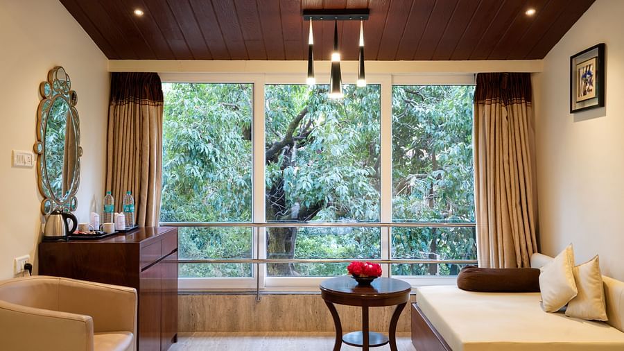 Image of the separate seating arrangement inside the grand classic room of the resort | The Grand Legacy Resort and Spa 