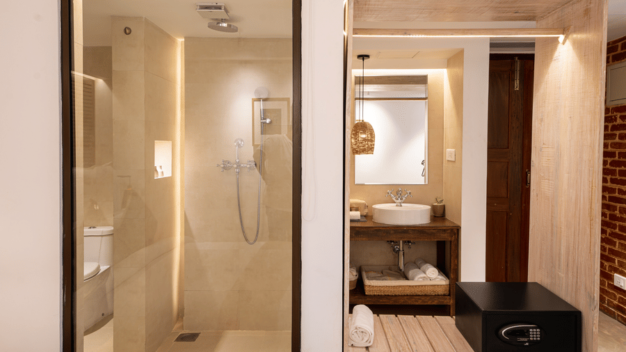A washroom featuring the shower area and the wash area - The Nanee