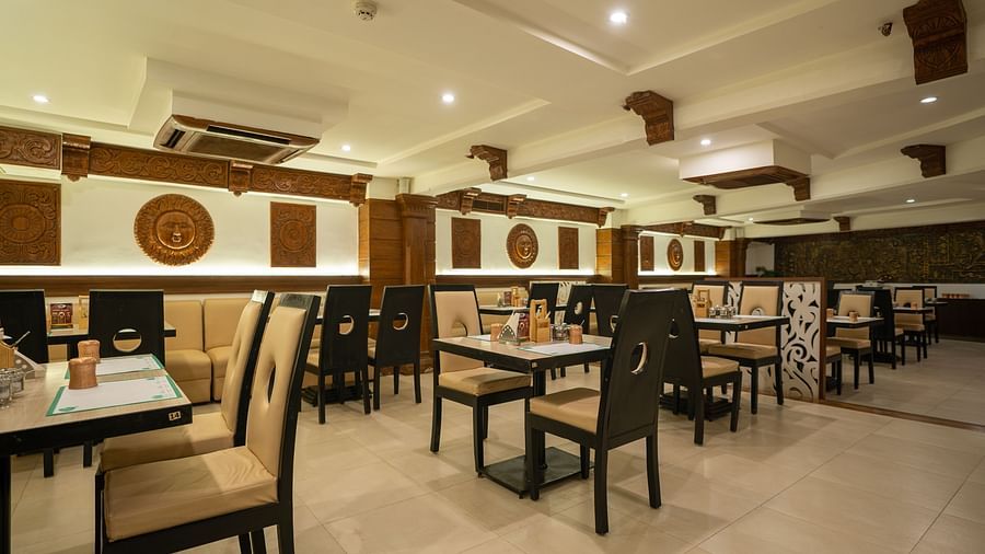 A  an image of the seating arrangement at the Andhra Ruchulu restuarant in The President Hotel, Hubli